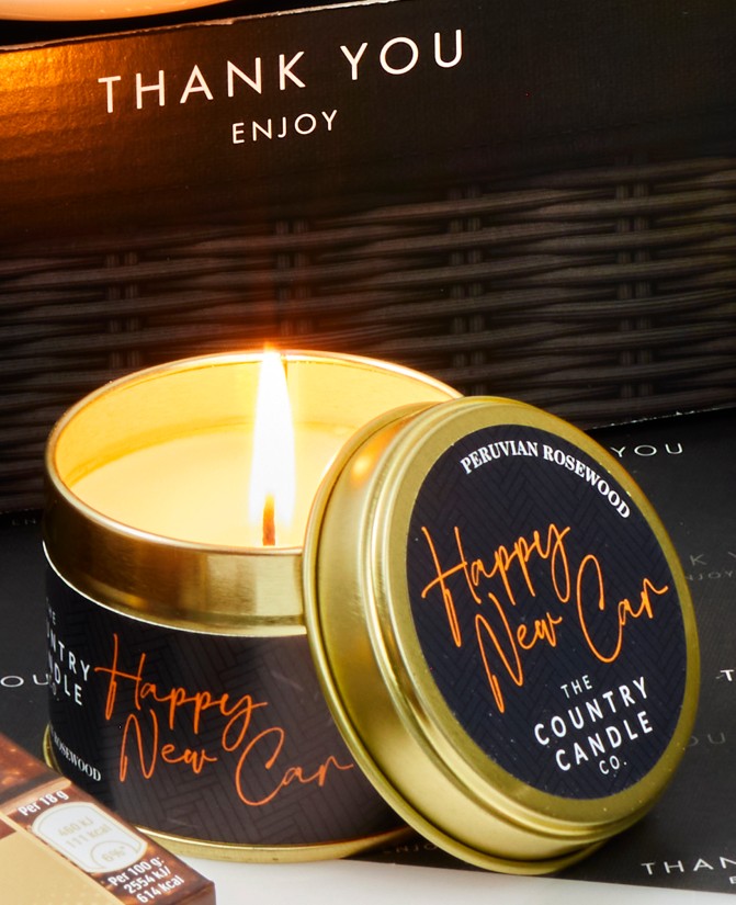 Happy New Car scented candle in a gold tin
