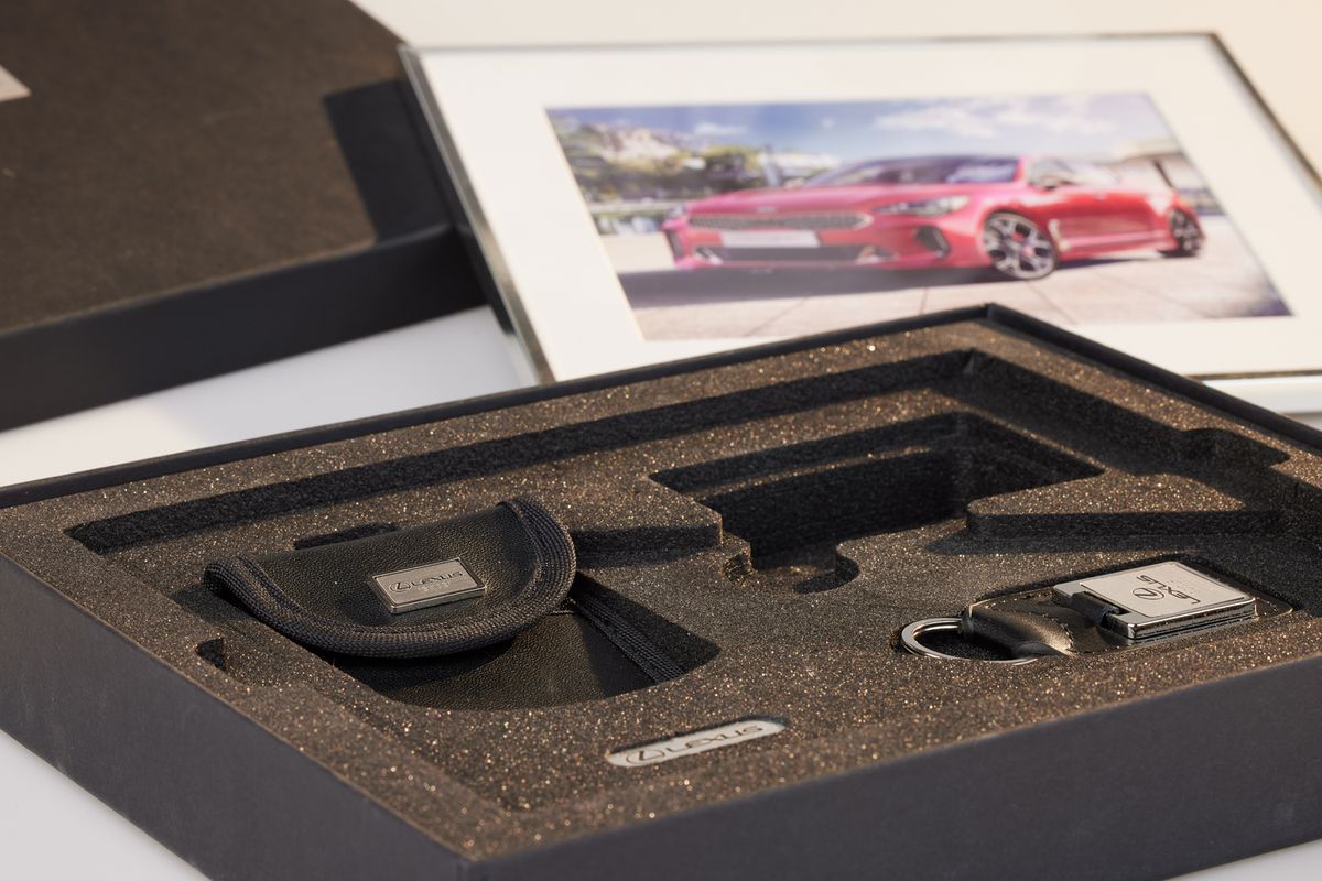 Close-up of the foam insert with branded RFID pouch, keyring and brand plate
