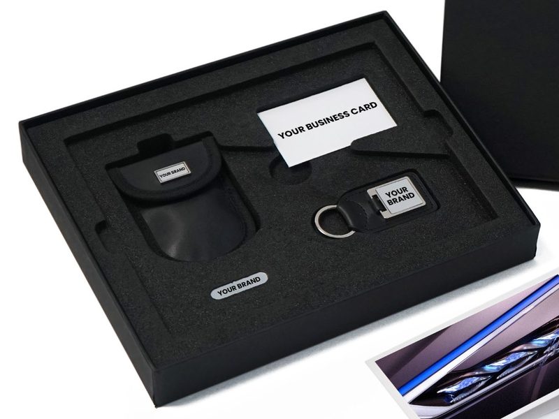 Black presentation box with fitted foam insert and brand plate